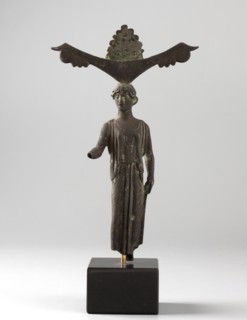 Mirror support with a depiction of Aphrodite. Aphrodite myth., Greek deity. Disc support for a