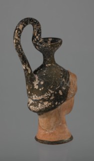 Oinochoe in the shape of a woman's head, repossession Bytom. Greece. Oinochoe, head iconography,