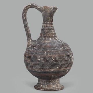 Oinochoe, unknown Cypriot workshop; Arsinoe Cyprus. Oinochoe on a cup-shaped foot with a spherical