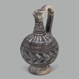 Oinochoe, unknown Cypriot workshop; Arsinoe Cyprus. Oinochoe on a cup-shaped foot with a spherical