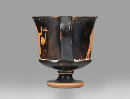 Red-figure kantharos with a depiction of an ephebe with an aryballos and a Greek inscription