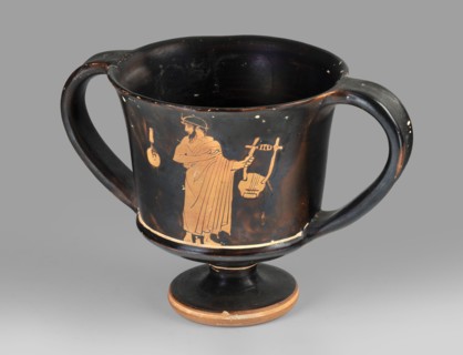Red-figure kantharos with a depiction of an ephebe with an aryballos and a Greek inscription