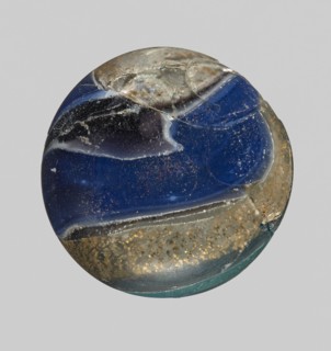 Unguentarium with carnation and a gold ribbon; bulging belly. Mosaic glass small bottle with