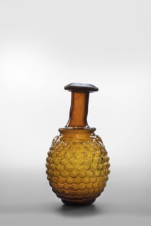 Bottle; with a bulging belly with decoration in the shape of a bunch of grapes; Syro-Palestine