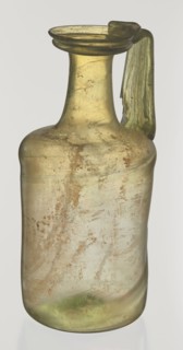 Jug. Cylindrical body, high neck with flared spout and vertical vice. 2nd–3rd century AD. Syria.