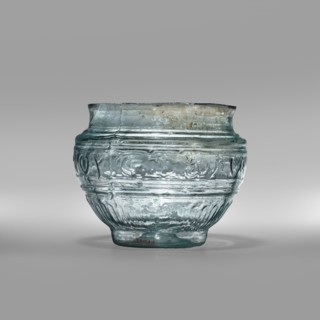 Bowl with Greek inscription. Glass bowl made of transparent, light blue glass with a Greek
