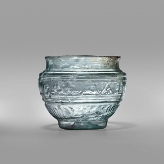 Bowl with Greek inscription. Glass bowl made of transparent, light blue glass with a Greek
