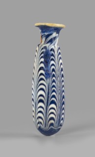 Alabastron, Egyptian workshop, 6th–5th century BC. Opaque dark blue glass alabastron decorated with