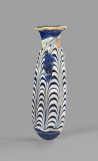 Alabastron, Egyptian workshop, 6th–5th century BC. Opaque dark blue glass decorated with