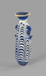 Alabastron, Egyptian workshop, 6th–5th century BC. Opaque dark blue glass alabastron decorated with