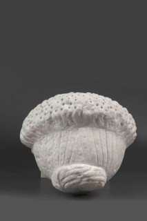 Portrait of a Roman woman, Head with a broad face and an elaborate hairstyle: hair twisted into