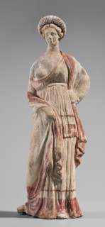 Figurine of a maenad, ca. 3rd–2nd century BC. A young woman standing in a wreath tied with a ribbon