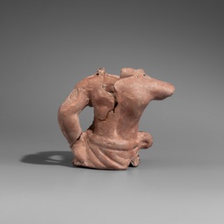 Actor's puppet, Male torso glued together from four fragments. Head, legs, and right arm missing.