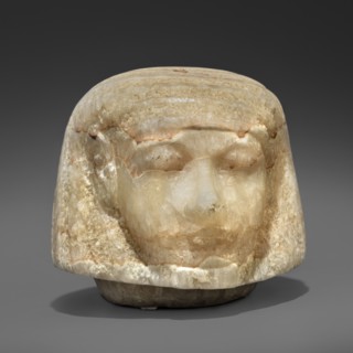 Canopic urn lid in the shape of a human head, Sons of Horus mythology, tomb equipment. This head is