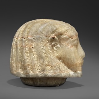 Canopic urn lid in the shape of a human head, Sons of Horus mythology; tomb equipment. This head is