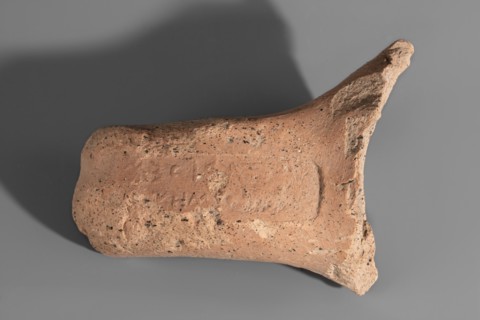 Fragment of a Sinopean amphora vice with a rectangular stamp impression on the upper surface. The