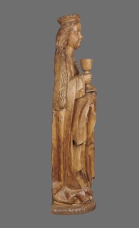 Figure of St. Barbara, medieval wall sculpture, hollowed out from behind head also has a circular
