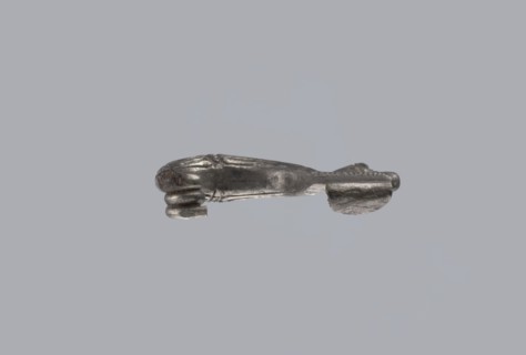 Snake-headed fibula, Southern Italian workshop. Fibula with an arched, thick hoop terminated on one