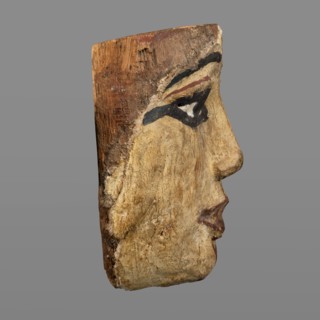 Woman's sarcophagus mask. Mask of wood covered with a layer of canvas to which paint is applied.