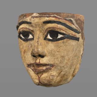 Woman's sarcophagus mask. Mask of wood covered with a layer of canvas to which paint is applied.