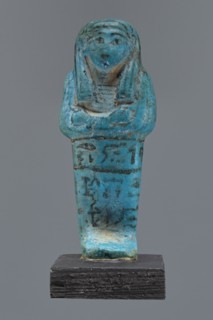 Ushabti Cha-em-uase. A mummy-shaped figurine shabti made of faience and pressed into a mold.