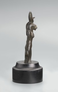 Sekhmet figurine, lion-headed goddess shown standing or walking with a lioness head in a tripartite
