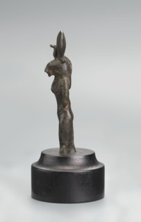 Sekhmet figurine, lion-headed goddess shown standing or walking. Lioness head with a tripartite wig