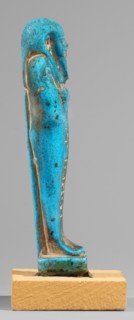 Padiamonnesut's shabti. Mummy-shaped figurine, standing on a base, supported at the back on a