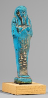 Padiamonnesut's shabti. Mummy-shaped figurine, standing on a base, supported at the back on a