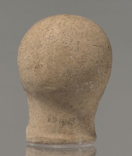 Votive head, unknown creator, Head of a young man covered with a shawl, from under which hair