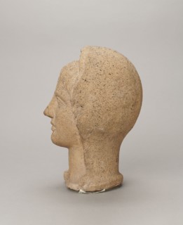 Votive head, Head of a young man covered with a shawl, from under which hair emerges in the form of