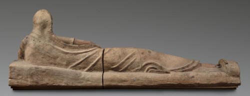 Sarcophagus lid, The deceased is depicted semi-reclining, resting his left forearm on a pillow and