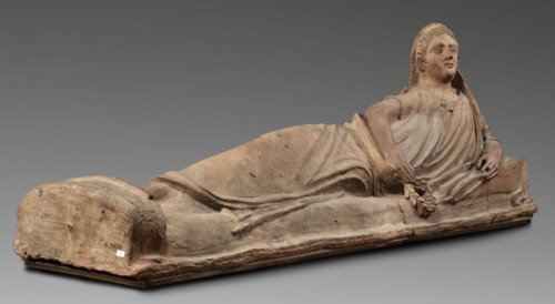 Sarcophagus lid, The deceased is shown in a semi-reclining position, resting his left forearm on a