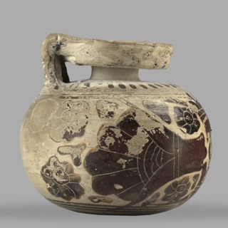 Orientalizing aryballos with depictions of lotus flowers; maker, used for oils and ointments; Greek
