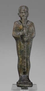 Figurine of the god Ptah; maker, restitution provenance; Ptah mythology; Egyptian deity; ankh and