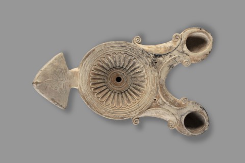 Two-burner oil lamp decorated with a rosette motif, end of the 1st century, Asia Minor; height 10.2