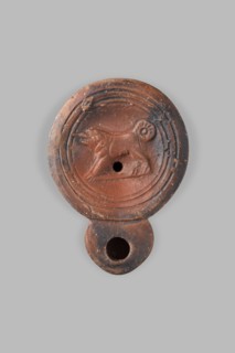 Lamp decorated with a depiction of a dog; unknown eastern workshop; single-burner oil lamp; dogs