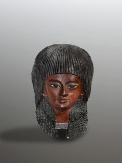 Mummy mask of a boy. The mask of a boy with a delicately modeled, almost girlish face is framed by