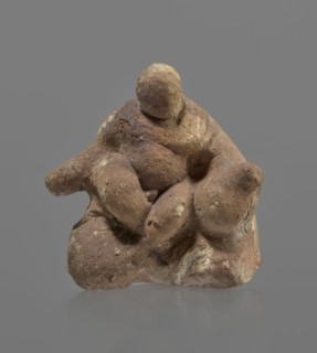 Terracotta figurine of Silenus, Silenus mythology, terracotta. Figurine of an obese Silenus sitting