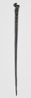 Pin, unknown Luristan workshop. Pin with a thin, oval shaft terminating in a head in the form of a
