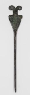 Pin, unknown Luristan workshop. Pin with a thin, oval shaft transitioning into a flat head composed