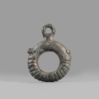 Decorative pendant from a horse harness, unknown Near Eastern workshop. The pendant is in the form