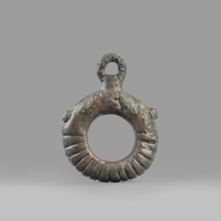 Decorative pendant from a horse harness, unknown Near Eastern workshop. The pendant is in the form