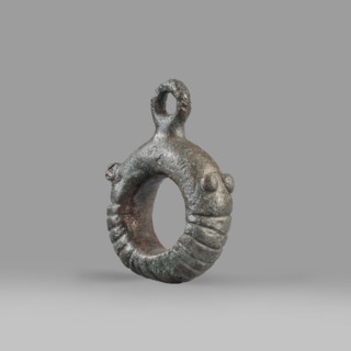 Decorative pendant from a horse harness, unknown Near Eastern workshop. The pendant is in the form