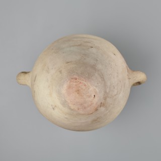 Large amphora with an ovoid shape and a rounded foot. Two small vertical vices placed on the body
