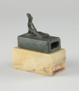 Snake sarcophagus; Snake with raised head, coils on a rectangular reliquary-sarcophagus—probably