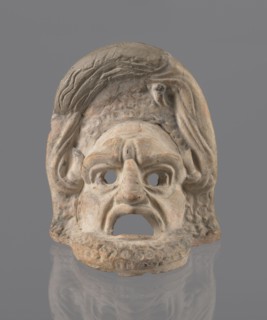 Tragic mask, terracotta, tragic masks, theater masks. Tragic mask depicting a male face. Likely a