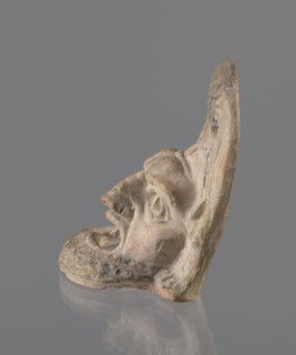 Tragic mask, terracotta, 4th–3rd century BC, Southern Italy. Tragic mask depicting a male face,