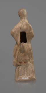 Terracotta figurine of a veiled woman, dancer, molded female figurine in fine-grained red clay