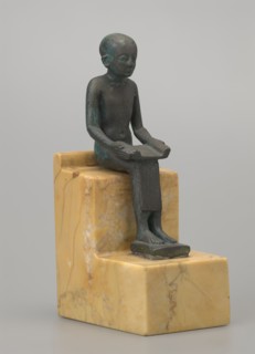 Figurine of Imhotep, Imhotep ca. 2667–2648 BC; mythology. Figurine of a seated Imhotep holding an